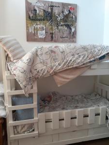 a white bunk bed with a blanket on top at 15 President Street in Parys in Parys