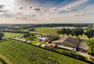 an aerial view of a farm with a train at Chalet Oppe Hook in Kessel
