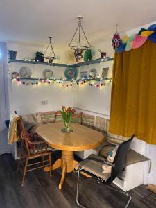 a dining room with a table and chairs at Cissbury in Midhurst