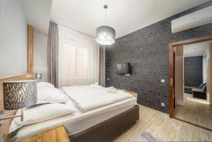 Postel nebo postele na pokoji v ubytování Park Hotel Ambrózia