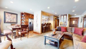a living room with a couch and a table at Snowcreek 269 Condo in Mammoth Lakes