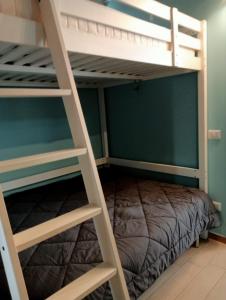 a bedroom with two bunk beds and a bed at Suite Panorama - attico esclusivo con vista Etna e Ionio in Riposto