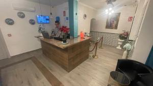 Telewizja i/lub zestaw kina domowego w obiekcie Hotel Boutique Andalucia