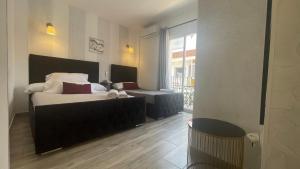Łóżko lub łóżka w pokoju w obiekcie Hotel Boutique Andalucia