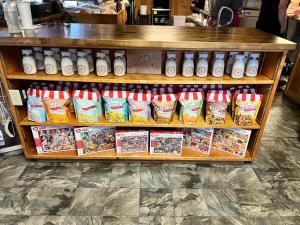 a store shelf filled with lots of differentiatesiatesiatesiatesiatesktop at adoba® Dreamland in Gulliver