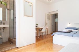 Postel nebo postele na pokoji v ubytování Milla Rooms
