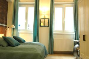 Posteľ alebo postele v izbe v ubytovaní Liszt Studio Holiday Home