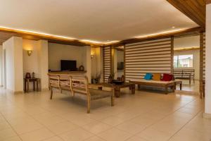 Μια τηλεόραση ή/και κέντρο ψυχαγωγίας στο Residencial Helbor Resort Aracaty