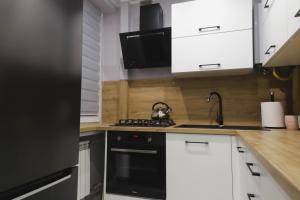 Kuchyň nebo kuchyňský kout v ubytování Apartament z Balkonem + 6 fotografií