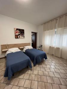 Кровать или кровати в номере Villa Gianna