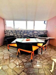 a room with a table and chairs in a room at Apartment Lucia in Omišalj