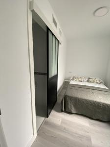 Ein Bett oder Betten in einem Zimmer der Unterkunft Apartamento Carihuela