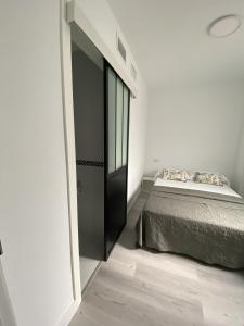 Posteľ alebo postele v izbe v ubytovaní Apartamento Carihuela