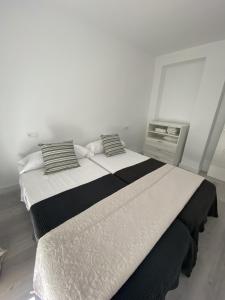Posteľ alebo postele v izbe v ubytovaní Apartamento Carihuela + 2 fotografie
