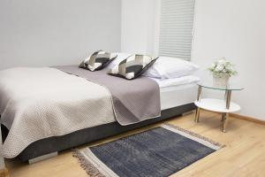 Łóżko lub łóżka w pokoju w obiekcie Apartamenty Legionów 30