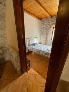 A bed or beds in a room at Find your peace in a traditional country house!!