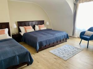 Posteľ alebo postele v izbe v ubytovaní Zámecký Hotel ANTON FLORIAN