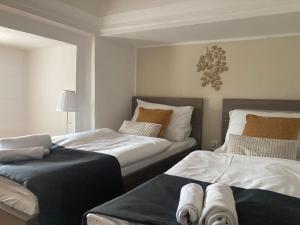 Posteľ alebo postele v izbe v ubytovaní Zámecký Hotel ANTON FLORIAN