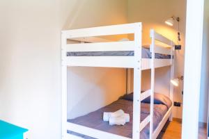 a bunk bed room with two bunk beds at Lemon Apartment with Garden and Sea View by Wonderful Italy in Bordighera +17 photos