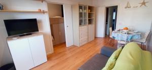 a living room with a couch and a flat screen tv at Arena in Hospitalet de l'Infant