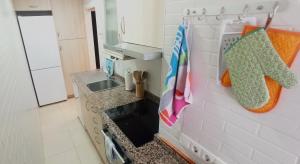 a kitchen with a sink and a counter top at Arena in Hospitalet de l'Infant +27 photos