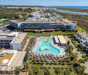 an aerial view of a resort with a swimming pool at AP Cabanas Beach & Nature - Adults Friendly in Cabanas de Tavira