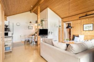 a living room with a couch and a table at Haus Sonnenhang Wohnung 3 in Stiefenhofen