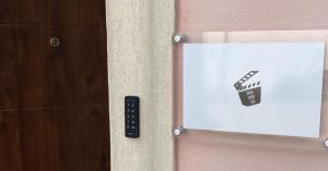 a door with a remote control next to a wall at Cinema Rooms Fiera Verona in Verona