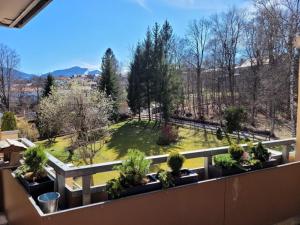 a balcony with a view of a garden at Ferienwohnung Schöne Auszeit in Oy-Mittelberg