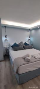 Ένα ή περισσότερα κρεβάτια σε δωμάτιο στο LEFKAS CITY APARTMENTS & Suites