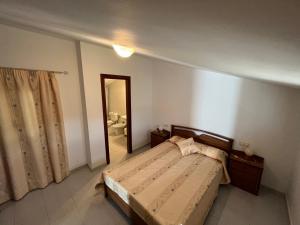 A bed or beds in a room at Apartamentos Camí L'atall Altamar