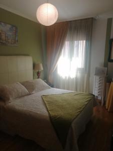 Posteľ alebo postele v izbe v ubytovaní Piso Vacacional O Salnes