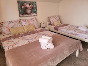 Ein Bett oder Betten in einem Zimmer der Unterkunft Rooms Sapina