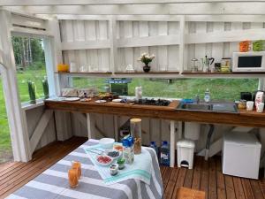 a kitchen with a table and a counter top at Sambla majutus in Hiiumaa