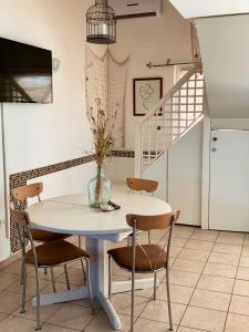 een eetkamer met een tafel en stoelen en een trap bij One bedroom appartement at Zaton 200 m away from the beach with furnished garden and wifi in Zaton