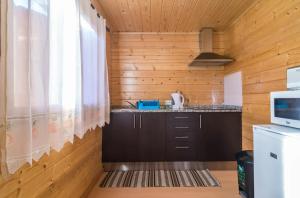 a kitchen with wooden walls and wooden counters at Cozy studio in Figueiró dos Vinhos 56 m² with shared pool in Figueiró dos Vinhos