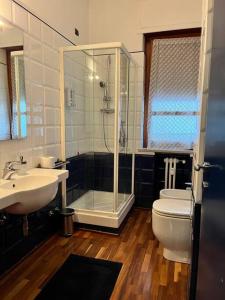 a bathroom with a shower and a toilet and a sink at CasaPratti Pescara centro in Pescara