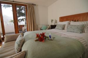 Un pat sau paturi într-o cameră la Casa Arrayán