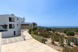 a white house with a view of the ocean at Villa Milan 2 Mastichari in Antimácheia