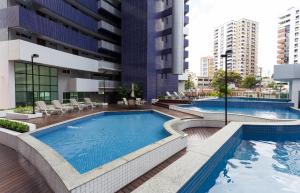 an image of a swimming pool in a building at VIP Beira Mar Residence in Fortaleza