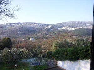 a view of a mountain from a house at Boschettoresidence in Perugia