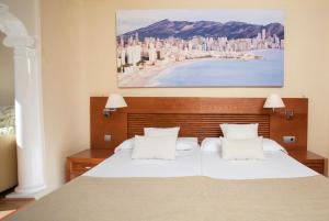 Postel nebo postele na pokoji v ubytování Magic Villa de Benidorm