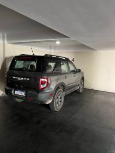 a silver and black car parked in a garage at Departamento INDIGO in Mendoza