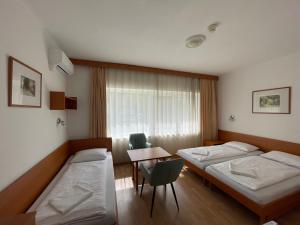 Postel nebo postele na pokoji v ubytování Hello Balcsi Apartmanház