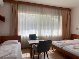 Postel nebo postele na pokoji v ubytování Hello Balcsi Apartmanház