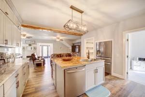 a kitchen with white cabinets and a counter top at Pet-Friendly Afton Vacation Rental with Game Room in Afton