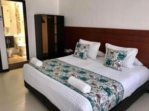 Postel nebo postele na pokoji v ubytování Hotel Casa Lamay