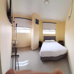 Ένα ή περισσότερα κρεβάτια σε δωμάτιο στο Hotel Barlovento Inn Piura