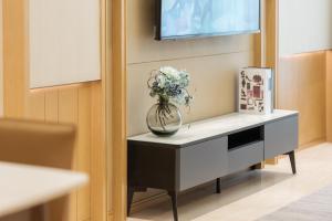 Sjónvarps- og/eða afþreyingartæki á Livetour Hotel Financial City Keyun Road Metro Guangzhou