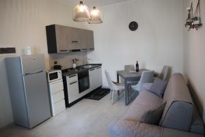 A kitchen or kitchenette at Sophia Apartments